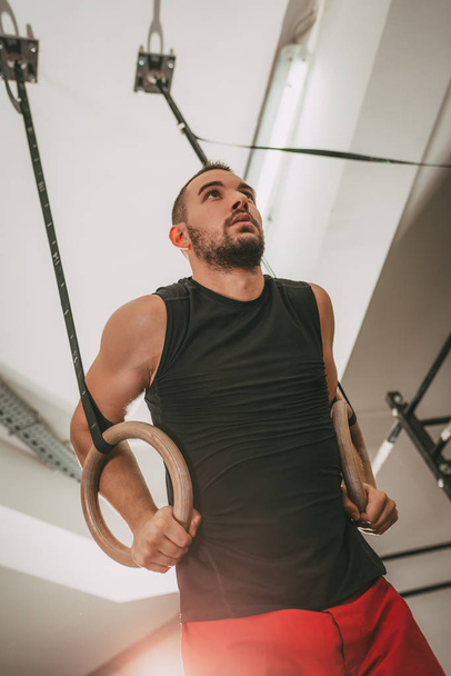 Young man exercising at Gym Ring - Fotografie, Obrázek