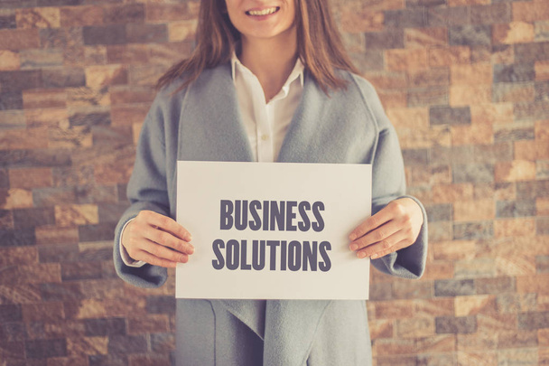 Woman presenting BUSINESS SOLUTIONS CONCEPT - Foto, Imagen