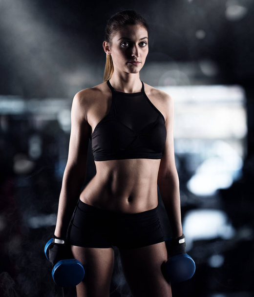 woman is training with weight dumbbells - Photo, image