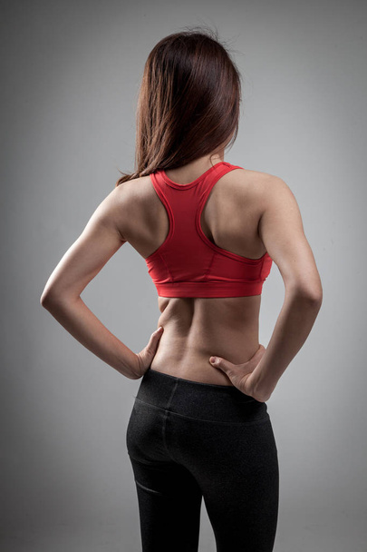 Back of Asian strong healthy  girl  with muscular body - Foto, imagen