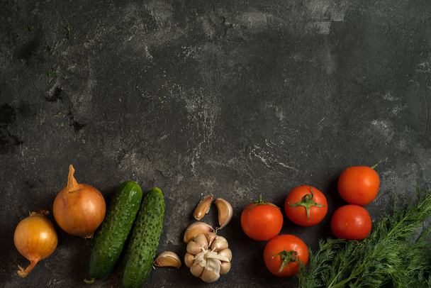 vegetables on a dark black background as a background for menu - Фото, зображення