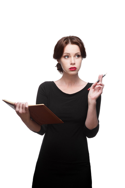 Thoughtful business woman with diary - Foto, Imagen