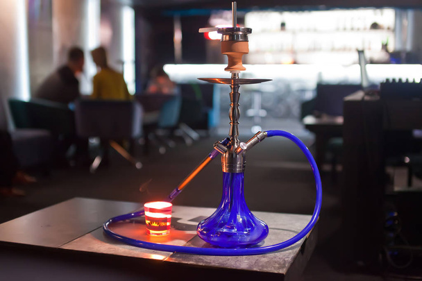 Close-up photo of blue hookah with tube - 写真・画像