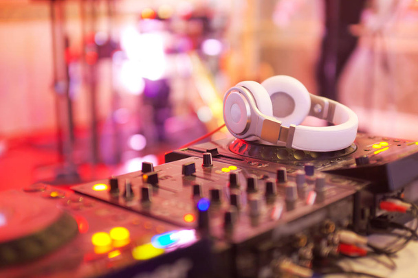 Mixing console with headphones at the night club - Valokuva, kuva