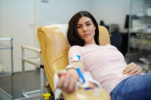 Pretty girl transfusing her blood - Photo, Image