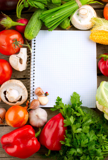 Open Notebook and Fresh Vegetables Background. Diet - Valokuva, kuva