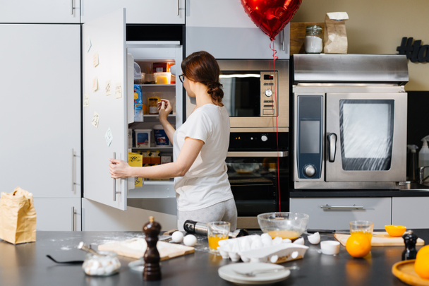 woman taking products from fridge - Photo, Image