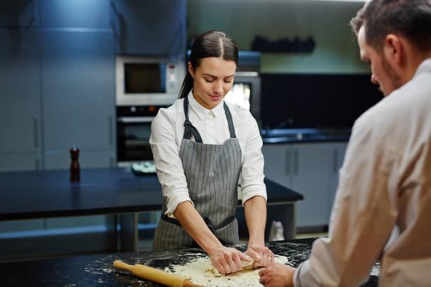 female trainee rolling dough - Photo, Image