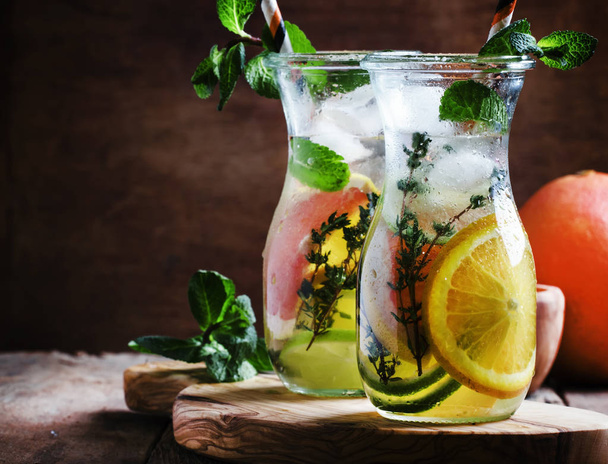 Citrus cool lemonade in glass jugs - Valokuva, kuva
