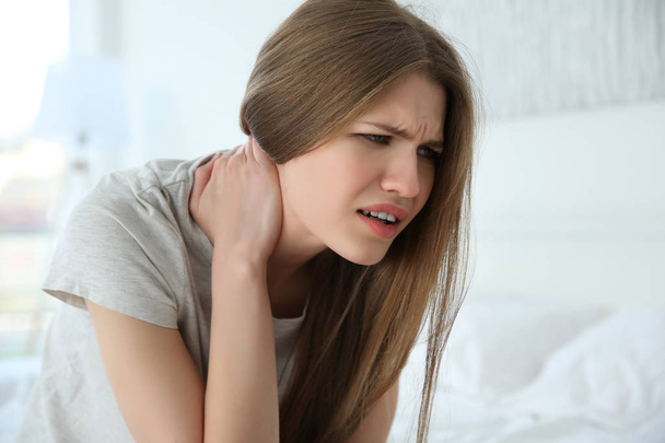 Pretty woman feeling neck pain at home - Fotografie, Obrázek