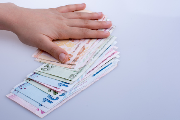 Billetes turksh lira en mano
 - Foto, imagen