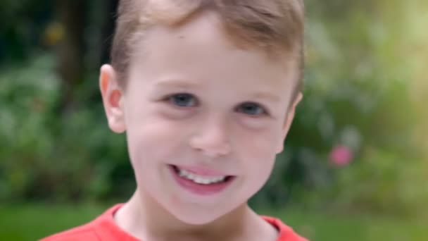 Portrait of an adorable 5 year old boy smiling CU - room for text - Footage, Video