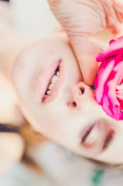 woman with pink rose - 写真・画像