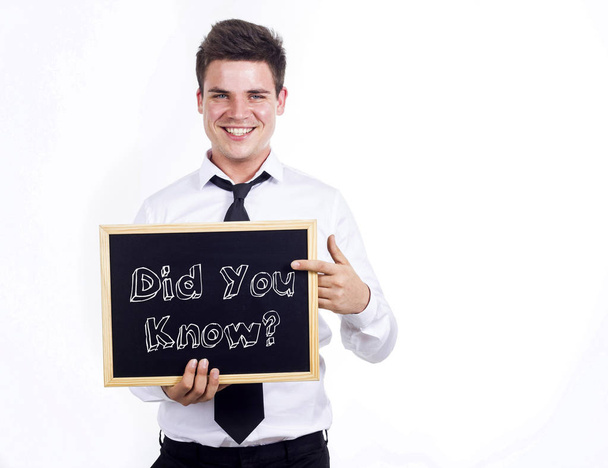 Did You Know? - Young smiling businessman holding chalkboard wit - Fotografie, Obrázek
