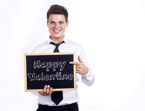 Happy Valentine - Young smiling businessman holding chalkboard w - Zdjęcie, obraz