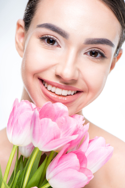 Woman with pink tulips bouquet - Foto, imagen