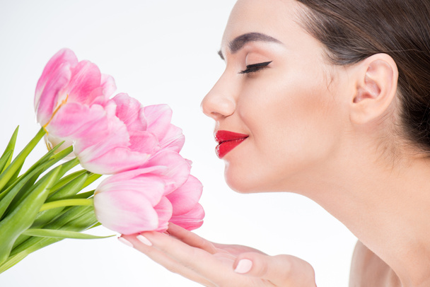 Woman with pink tulips bouquet - Valokuva, kuva