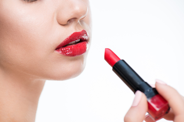 woman holding red lipstick  - Foto, imagen