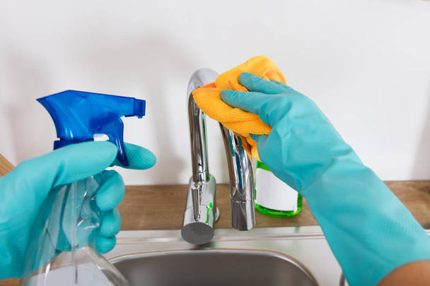 Person Cleaning Sink Tap - Foto, Imagen