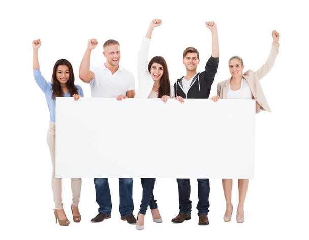 A Group Of Successful People With Different Multi Ethnicity Holding Billboard On White Background - Foto, imagen