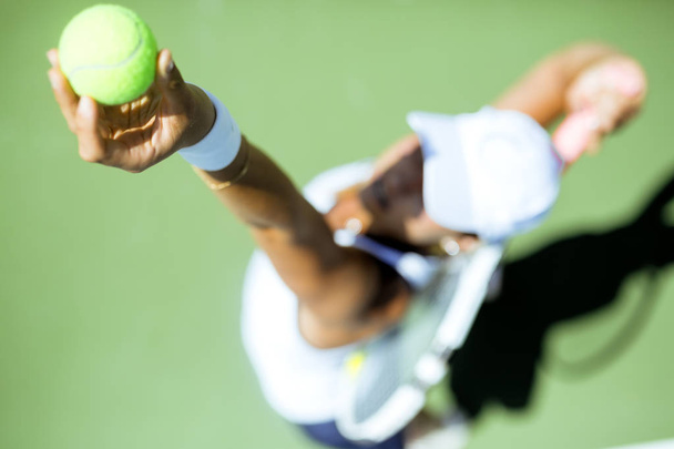 female tennis player serving - Foto, Imagen