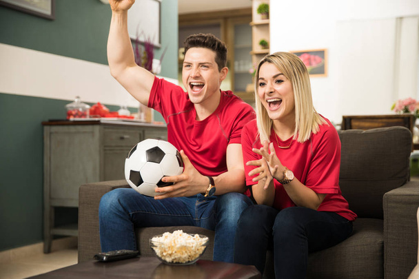 Excited soccer fans watching game - Foto, Imagen