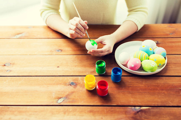 close up of woman hands coloring easter eggs - Photo, image