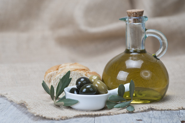 Olive oil with olives and bread - Photo, Image