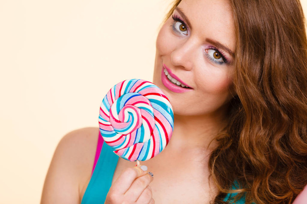 Woman joyful girl with lollipop candy - Фото, зображення