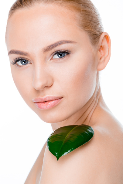 woman with green leaf - Zdjęcie, obraz