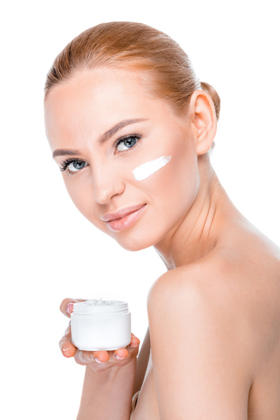 mujer mostrando crema facial
 - Foto, Imagen
