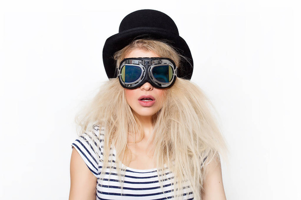 Pretty blonde girl portrait wearing strange sunglasses and black hat - Photo, Image