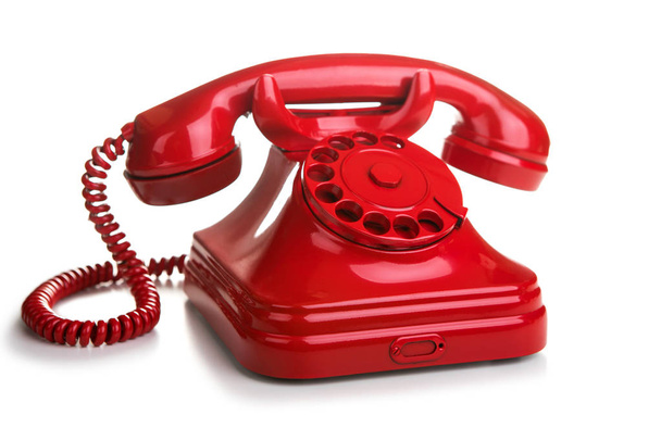rotes Retro-Telefon auf weißem Hintergrund - Foto, Bild