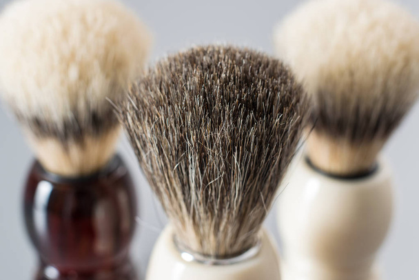 Shaving brush isolated on grey background. - Foto, imagen