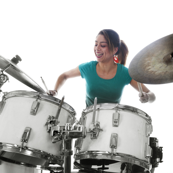 brunette brazilian woman plays the drums in studio - Foto, afbeelding