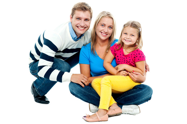 Portrait of happy couple smiling with cute daughter - Foto, Imagen