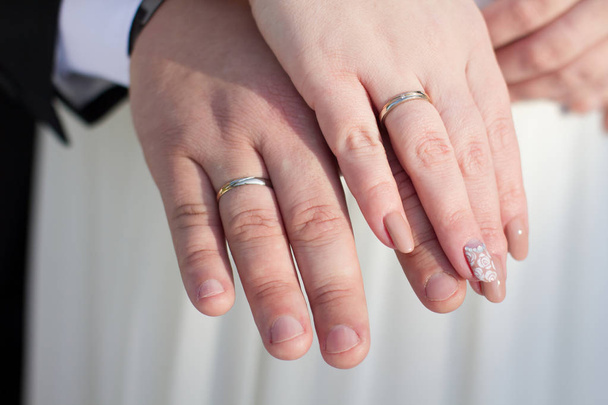 Hands with the wedding rings - Photo, Image