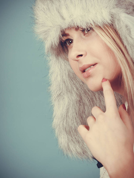 Blonde woman in winter warm furry hat - Foto, Imagen