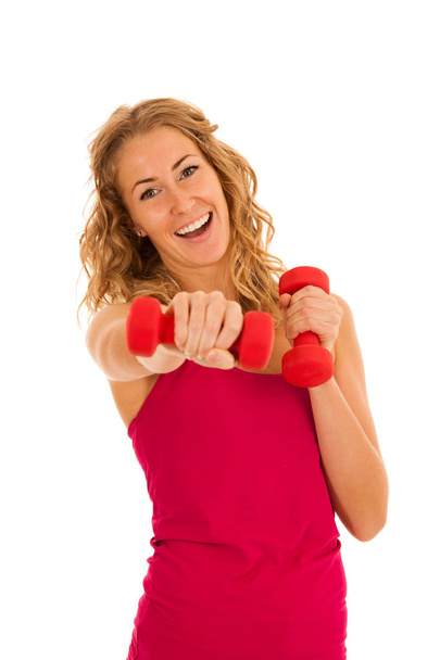 Cute young blond woman working out in fitness gym isolated over  - Photo, image