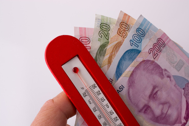 Billetes de Lira turca al lado de una temperatura de color rojo
 - Foto, Imagen