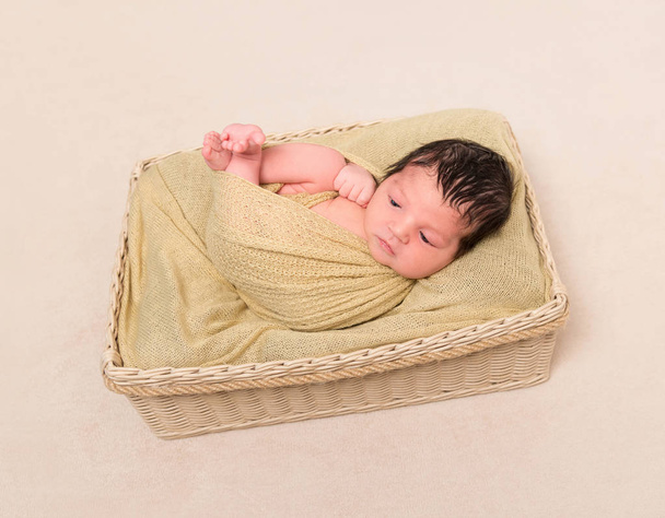 Wrapped black-haired baby basket, topview - Photo, Image