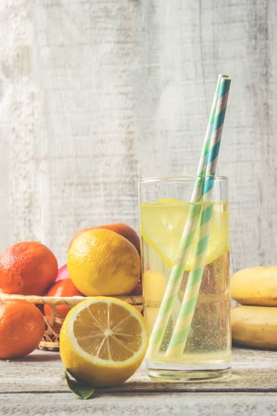 fresh lemon juice, lemonade with fruit for dessert. Selective focus.  - Photo, Image