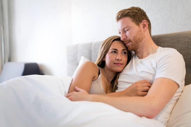 Romantic couple in bed  - Fotografie, Obrázek