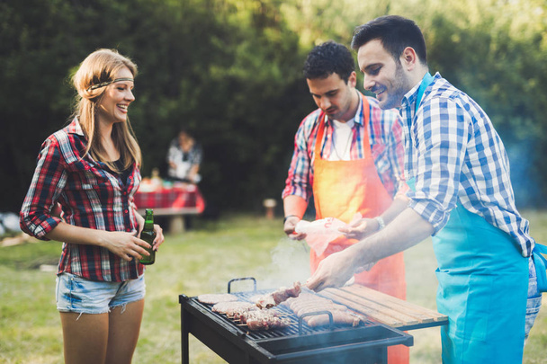 Friends having barbecue party - Фото, зображення
