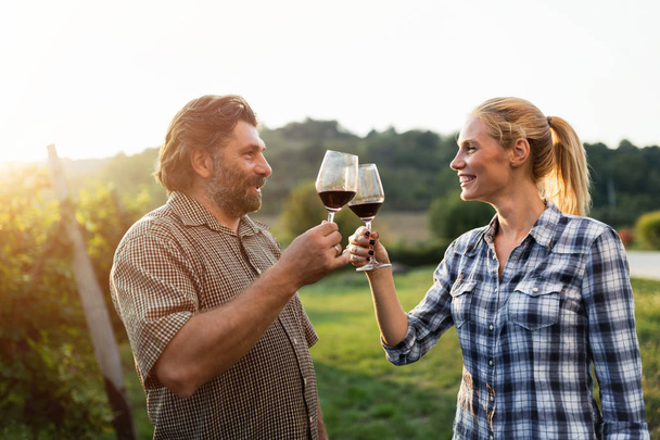 Winegrower family tasting wine  - Photo, image