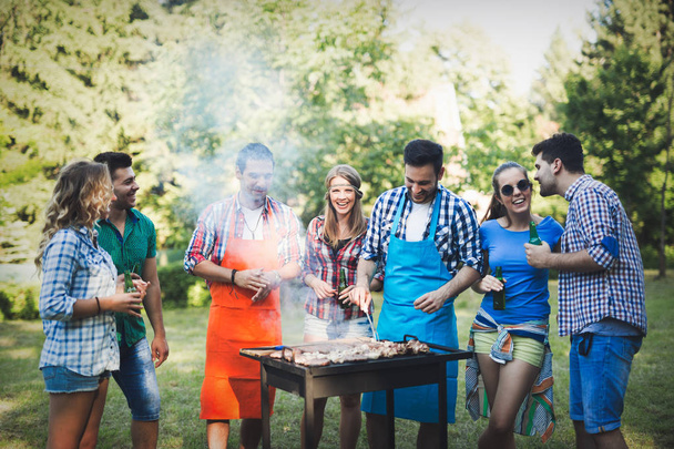 Friends having barbecue party - Foto, immagini