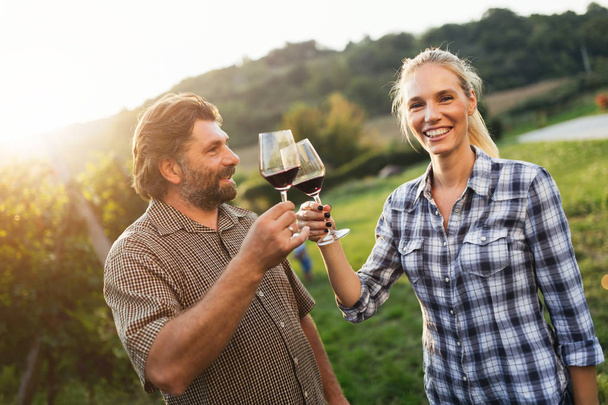 Winegrower family tasting wine  - Фото, зображення