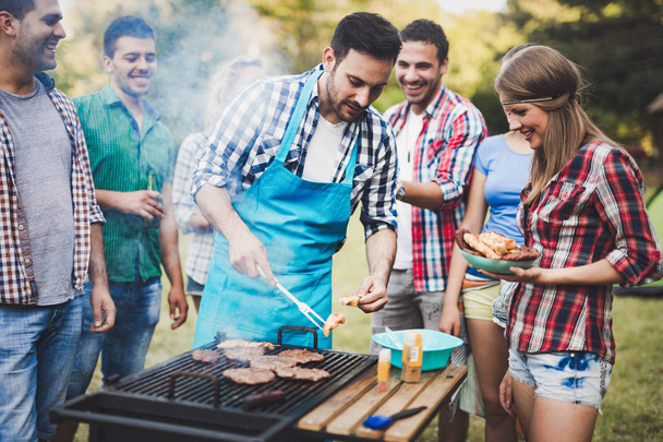 Friends having barbecue party - Foto, immagini