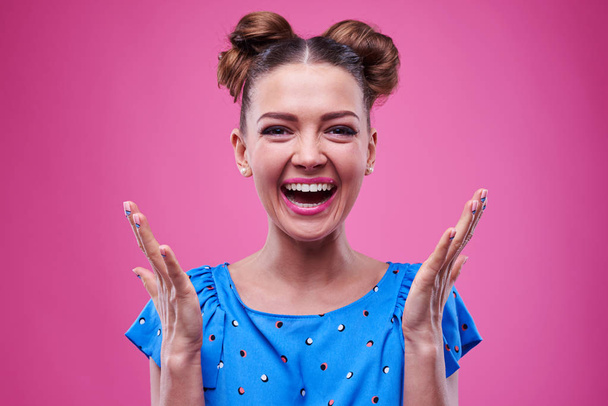 Delightful surprised and laughing young Caucasian woman with rai - Photo, Image