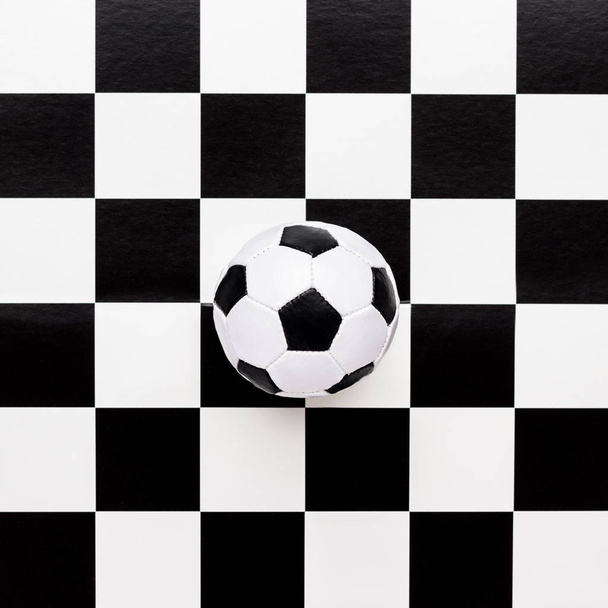 soccer ball on chequered pattern - Fotoğraf, Görsel